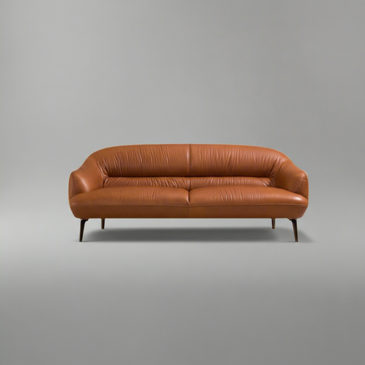 Brown leather sofa on a gray background
