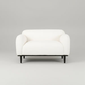White armchair with black legs on a white background