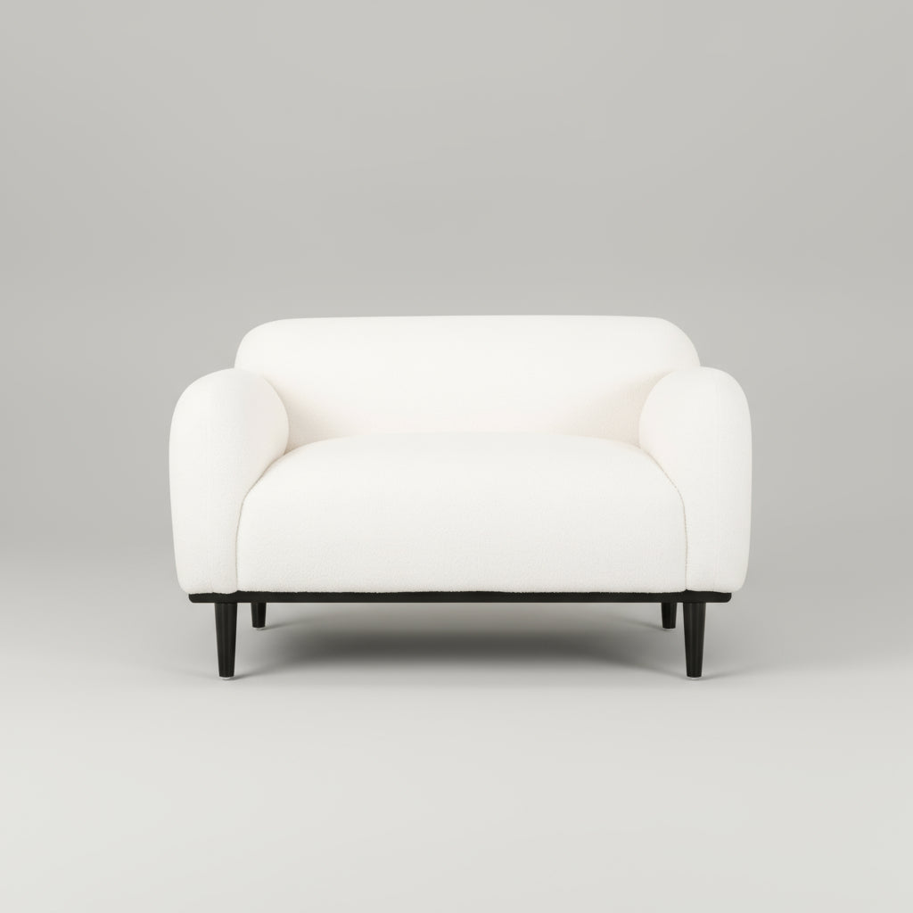 White armchair with black legs on a white background