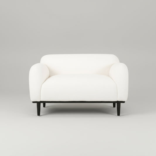 White armchair with black legs on a white background