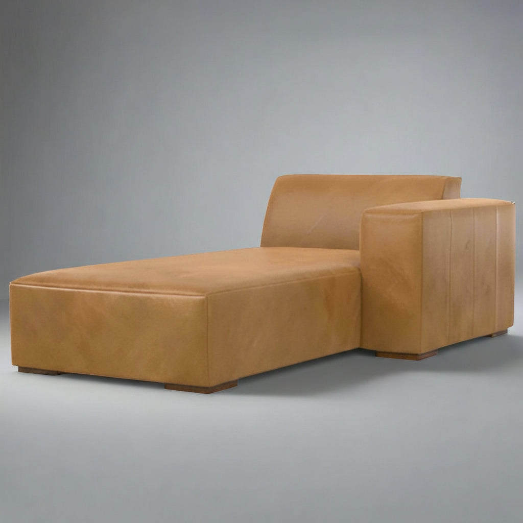 Brown leather chaise lounge on a white background