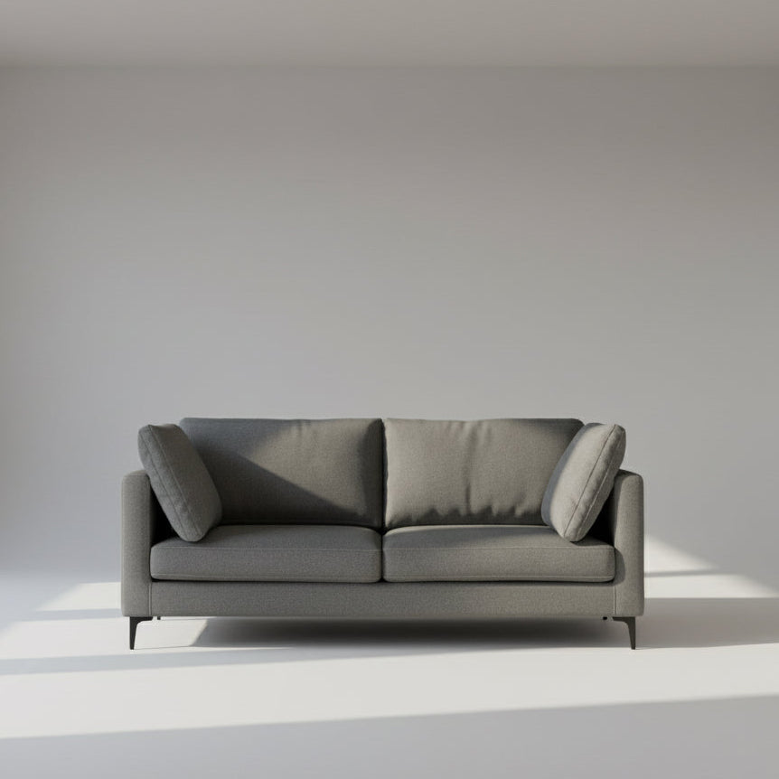 Gray sofa with cushions on a white background