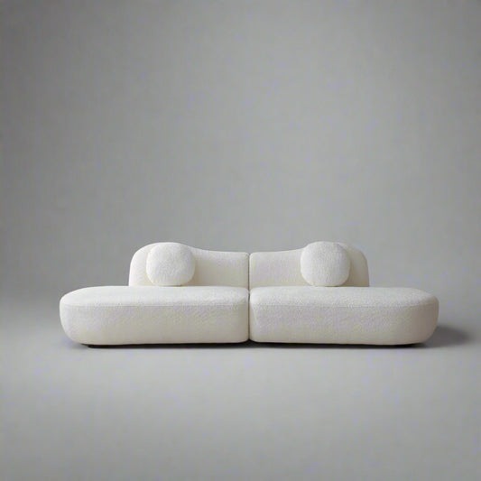 Modern white sofa against a plain background