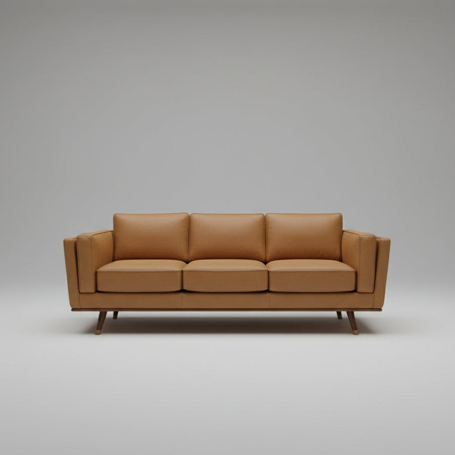 Brown leather sofa on a gray background