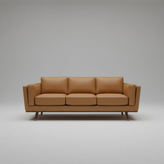 Brown leather sofa on a gray background