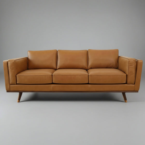 Brown leather sofa on a gray background