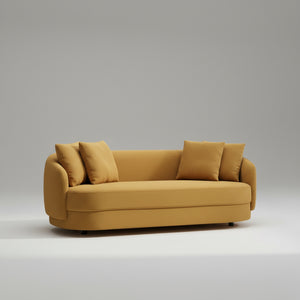 Mustard yellow sofa with cushions on a white background