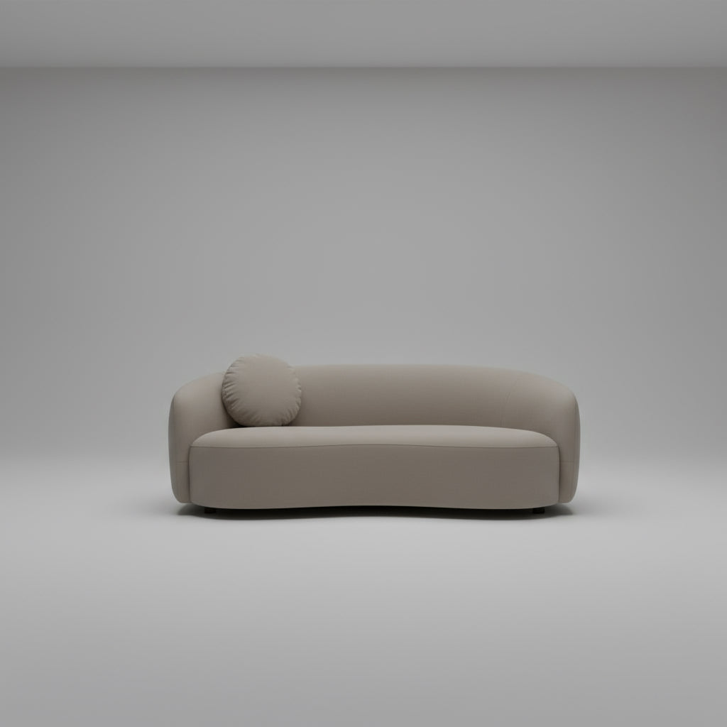 Beige sofa with a round cushion on a light gray background