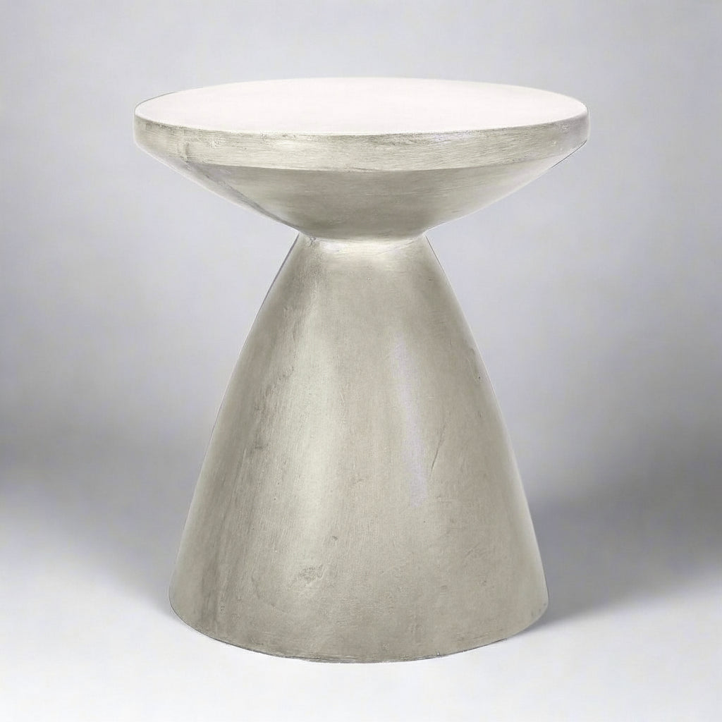 Concrete side table with a unique design on a light gray background
