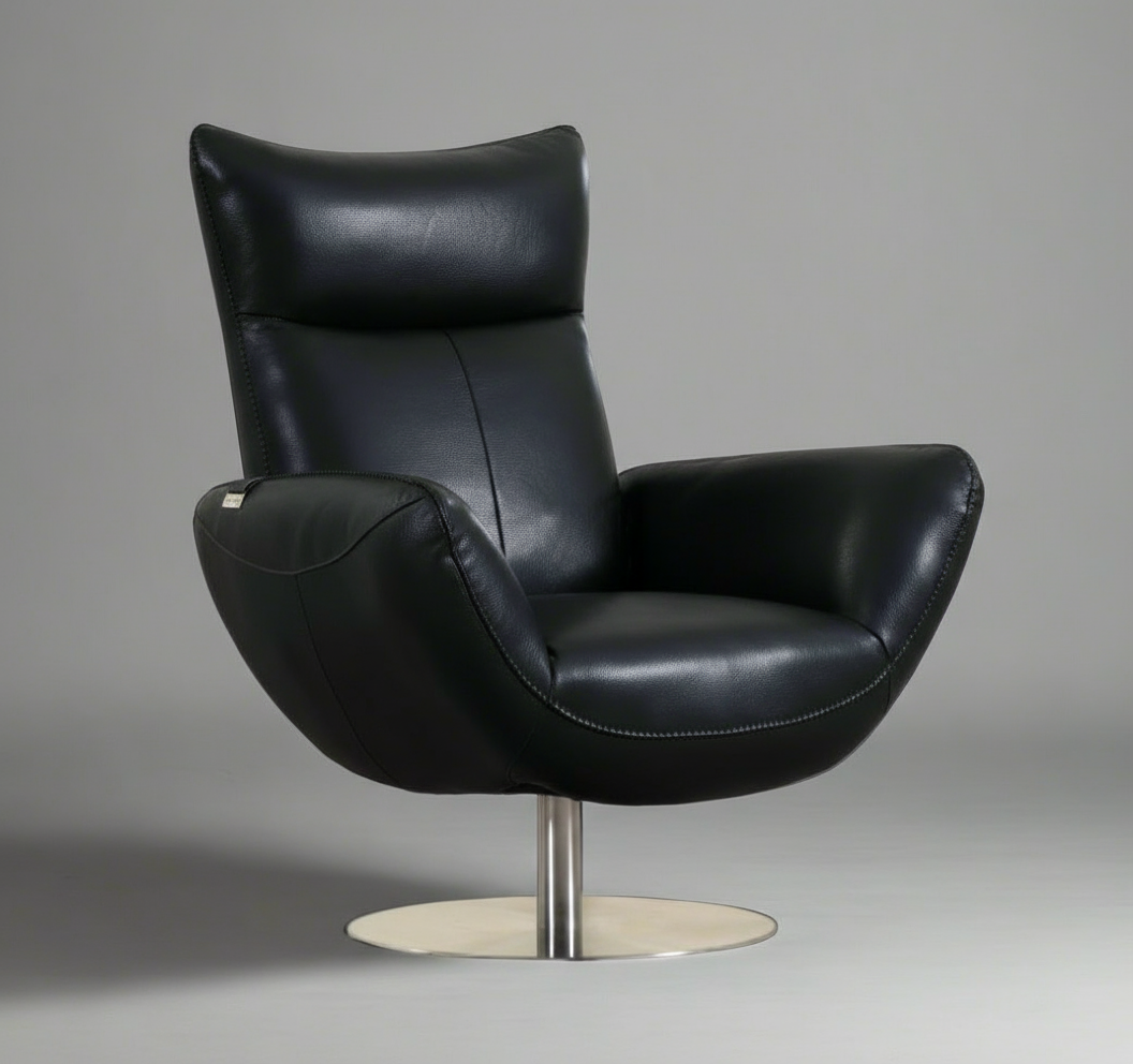 Black leather armchair with a metallic base on a gray background