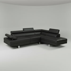 Black leather sectional sofa on a gray background