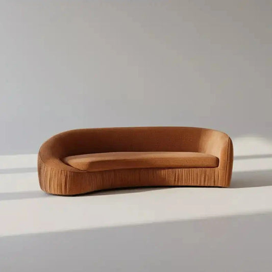 Brown sofa on a white surface with a gray background
