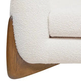 Close-up of a textured white cushion on a wooden chair