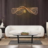 Modern living room with a white sofa, round coffee table, and decorative pendant light.