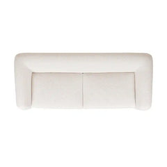 Beige upholstered bench on a white background
