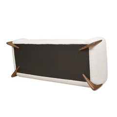 Pet bed with wooden legs on a white background