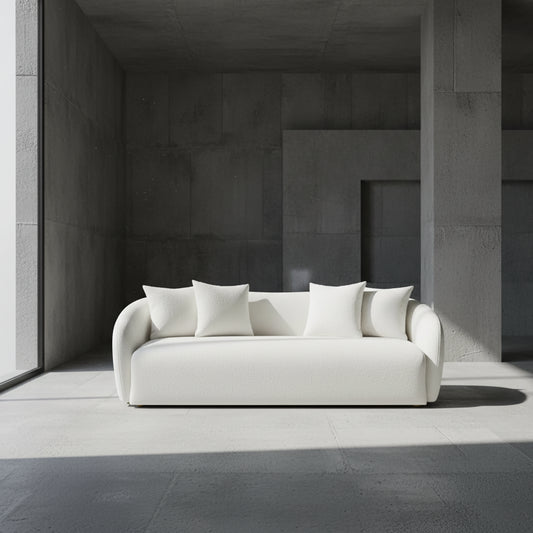 White sofa with four cushions on a gray background