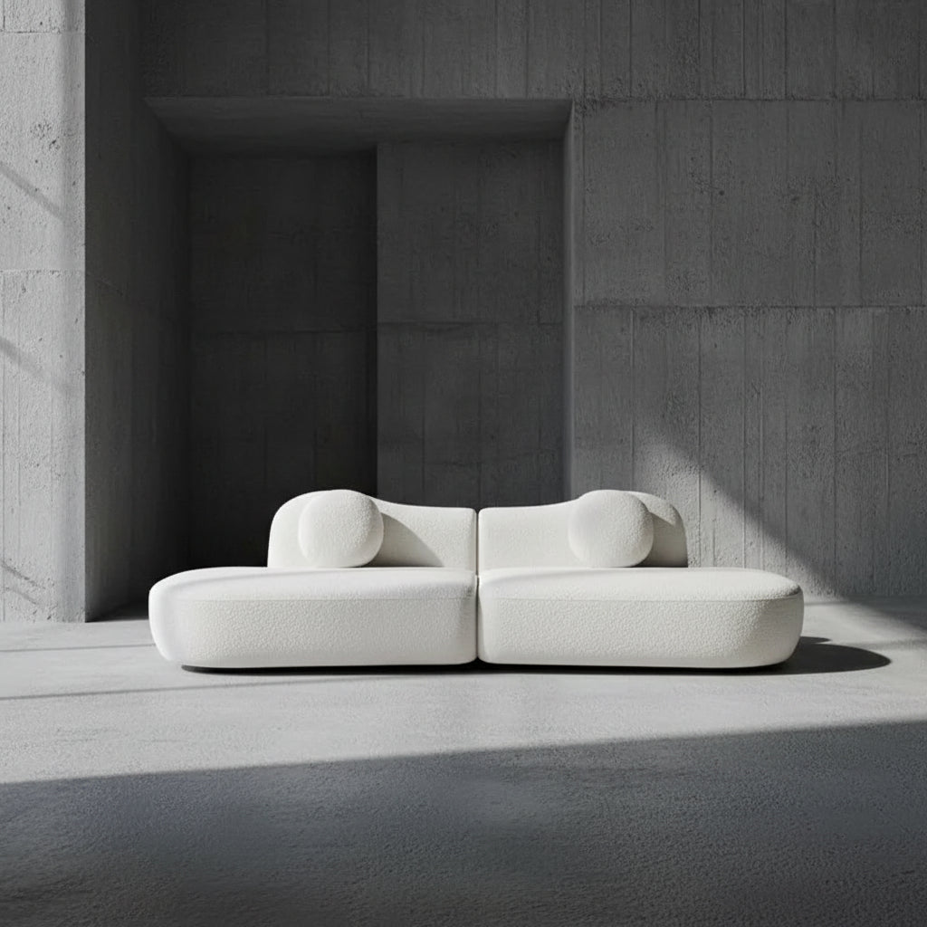 Modern white sofa against a plain background