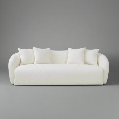 White sofa with four cushions on a white background