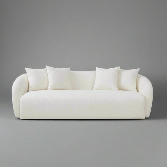 White sofa with four cushions on a white background