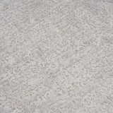 Extreme close-up of the premium Stone Grey chenille upholstery on THE ORVILLE sofa, showing the intricate woven texture and soft, durable fabric fibers.
