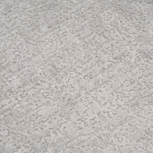 Extreme close-up of the premium Mist Grey chenille upholstery on THE ORVILLE sofa, showing the intricate woven texture and soft, durable fabric fibers.